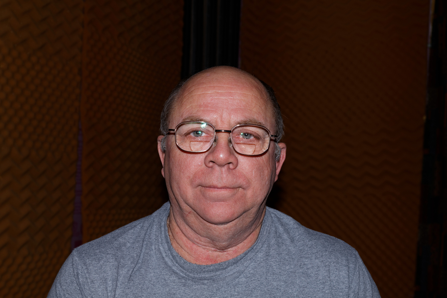 Faron Collins wire rim glass and bald head